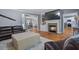 Inviting living room featuring a fireplace and an open layout connecting to the dining area at 428 Gold Xing, Canton, GA 30114