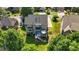 Aerial view of a home featuring a deck, patio, fenced yard, and surrounded by mature trees in a neighborhood at 428 Gold Xing, Canton, GA 30114