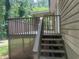 Back deck with wooden stairs offers a space for outdoor relaxation at 4434 Janice Dr, Snellville, GA 30039