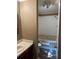 This bathroom boasts a bathtub with shower, modern toilet, sink with vanity, and great lighting at 4434 Janice Dr, Snellville, GA 30039