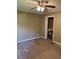 Bedroom with neutral paint, carpeted floors, and a doorway to another room at 4434 Janice Dr, Snellville, GA 30039