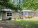 Inviting single-story home featuring well-maintained lawn and front yard landscaping at 4434 Janice Dr, Snellville, GA 30039