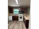 Updated kitchen with white appliances, stone countertops and dark cabinets at 4434 Janice Dr, Snellville, GA 30039