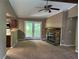 Cozy living room with stone fireplace and access to an outdoor patio at 4434 Janice Dr, Snellville, GA 30039