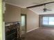 Spacious living room showcasing a stone fireplace, ceiling fan, and natural light at 4434 Janice Dr, Snellville, GA 30039