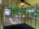 Screened in porch with wooden flooring and ceiling fan, overlooking backyard at 4434 Janice Dr, Snellville, GA 30039