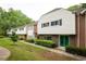 Attractive townhome community with manicured lawns and vibrant greenery, a welcoming neighborhood at 7098 Stonington Dr, Atlanta, GA 30328