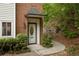 Inviting front entrance with a well-maintained walkway and charming landscaping at 7098 Stonington Dr, Atlanta, GA 30328