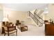 Comfortable living room featuring plush seating, neutral decor, and staircase leading to another level at 7098 Stonington Dr, Atlanta, GA 30328