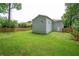 Extensive backyard featuring a wooden fence, well maintained lawn and a fire pit for outdoor gatherings at 963 Turner Se Dr, Smyrna, GA 30080