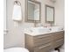 Modern bathroom featuring double sinks, framed mirrors, and stylish cabinets with a view of the tub at 963 Turner Se Dr, Smyrna, GA 30080