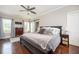 Bedroom with hardwood floors, and a king size bed with a view of the windows in the room at 963 Turner Se Dr, Smyrna, GA 30080