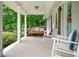 Inviting front porch with a porch swing and rocking chairs, perfect for enjoying quiet moments outdoors at 963 Turner Se Dr, Smyrna, GA 30080