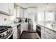 Modern kitchen featuring stainless appliances, granite countertops, and ample cabinetry at 963 Turner Se Dr, Smyrna, GA 30080