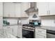 Kitchen with stainless appliances, granite countertops and white cabinets at 963 Turner Se Dr, Smyrna, GA 30080