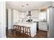 Bright white kitchen with stainless steel appliances, granite countertops and kitchen island at 963 Turner Se Dr, Smyrna, GA 30080