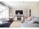 Cozy living room with a plush sectional sofa, stylish decor, and a modern entertainment center at 963 Turner Se Dr, Smyrna, GA 30080