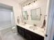 Contemporary bathroom with double sinks, quartz countertops, and a separate tub and shower at 306 Coppergate Ct, Canton, GA 30115