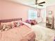 Cozy bedroom with pink decor, a plush bed, and ample storage, ideal for a room at 306 Coppergate Ct, Canton, GA 30115