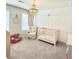 Inviting Bedroom with a crib, plush armchair, and decorative chandelier at 306 Coppergate Ct, Canton, GA 30115