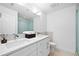 Modern bathroom featuring a double vanity with stone countertops, a walk-in shower, and sleek fixtures at 560 Edgehill Pl, Johns Creek, GA 30022