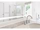 Bright bathroom showcasing a marble countertop, modern sink, and illuminated mirror at 560 Edgehill Pl, Johns Creek, GA 30022