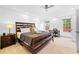 Bright bedroom with a ceiling fan, recessed lighting, and a dedicated workspace by the windows at 560 Edgehill Pl, Johns Creek, GA 30022