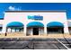 Commercial building featuring Big Blue Swim School with attractive architecture and well-maintained parking area at 560 Edgehill Pl, Johns Creek, GA 30022