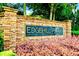 Elegant stone sign for Edgehill Place, set amidst blooming flowers and lush greenery, marking the neighborhood entrance at 560 Edgehill Pl, Johns Creek, GA 30022