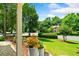 Inviting front yard view showcasing lush landscaping, mature trees, and a glimpse of a well-maintained home at 560 Edgehill Pl, Johns Creek, GA 30022