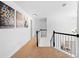 Upstairs landing featuring neutral carpeting and decorative wall art at 560 Edgehill Pl, Johns Creek, GA 30022
