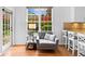 Cozy sitting area with large windows and access to the outdoor patio at 560 Edgehill Pl, Johns Creek, GA 30022