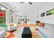 Bright living room with hardwood floors that flow into the open kitchen with barstool seating at 560 Edgehill Pl, Johns Creek, GA 30022