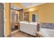 Bathroom showcasing a glass-enclosed shower, vanity with a mirror, and tile accents at 5735 Lake Windsor Pkwy, Buford, GA 30518