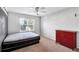 Cozy bedroom featuring a bed, dresser, window, and neutral decor at 5735 Lake Windsor Pkwy, Buford, GA 30518