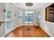 Bright breakfast nook with large windows, decorative light fixture, and access to the backyard at 5735 Lake Windsor Pkwy, Buford, GA 30518