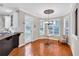 Sunny breakfast nook adjacent to the kitchen with a table and chair set at 5735 Lake Windsor Pkwy, Buford, GA 30518