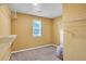 Spacious walk-in closet with ample shelving and a window, providing plenty of storage space at 5735 Lake Windsor Pkwy, Buford, GA 30518