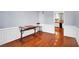 Bright dining area with hardwood floors, view to kitchen with white cabinets at 5735 Lake Windsor Pkwy, Buford, GA 30518