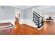 Spacious foyer with hardwood floors, staircase, and views to other rooms at 5735 Lake Windsor Pkwy, Buford, GA 30518