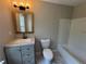 Bathroom showing tile floors, a gray vanity, modern lighting, and a shower and bathtub combo at 6798 Blackstone Pl # 12, Mableton, GA 30126