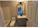 Well-lit bathroom with a tub-shower combo, gray vanity, and modern fixtures at 6798 Blackstone Pl # 12, Mableton, GA 30126