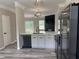 The kitchen provides barstool seating and views into the living area and outdoor deck at 6798 Blackstone Pl # 12, Mableton, GA 30126