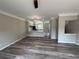 Spacious living room featuring modern gray walls, flooring, and a view of the kitchen at 6798 Blackstone Pl # 12, Mableton, GA 30126