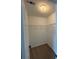Carpeted walk-in closet with wire shelving and a ceiling light fixture at 6798 Blackstone Pl # 12, Mableton, GA 30126