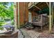 Brick home exterior with a back patio and a landscaped backyard with trees at 830 Barnett Ne St # 2, Atlanta, GA 30306