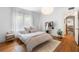 Bright bedroom with hardwood floors, a large window, and an airy, comfortable aesthetic at 830 Barnett Ne St # 2, Atlanta, GA 30306