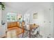 Bright dining area with hardwood floors, modern table, and an open layout to the kitchen at 830 Barnett Ne St # 2, Atlanta, GA 30306