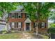 Charming two-story brick home featuring black shutters and a well-maintained front yard at 830 Barnett Ne St # 2, Atlanta, GA 30306