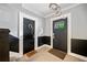 Hallway showcasing decorative doors and wall paneling with an exit sign above one door at 830 Barnett Ne St # 2, Atlanta, GA 30306